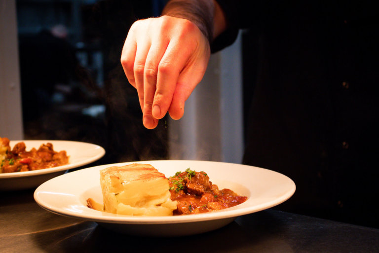 Chef seasoning food